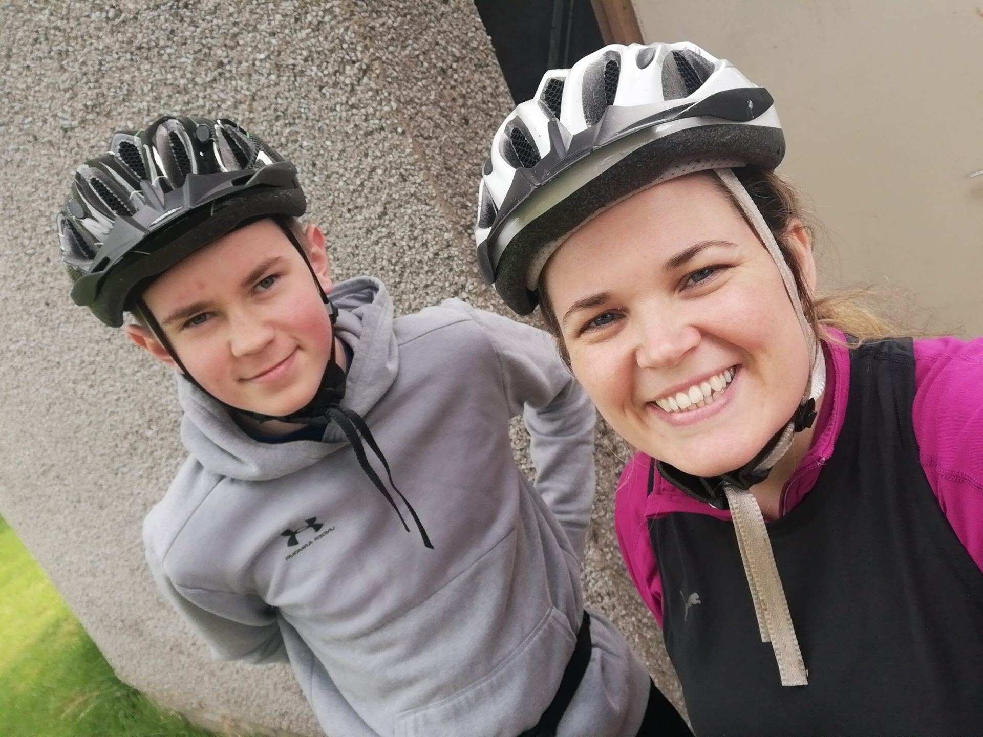 Young person and staff member out cycling together
